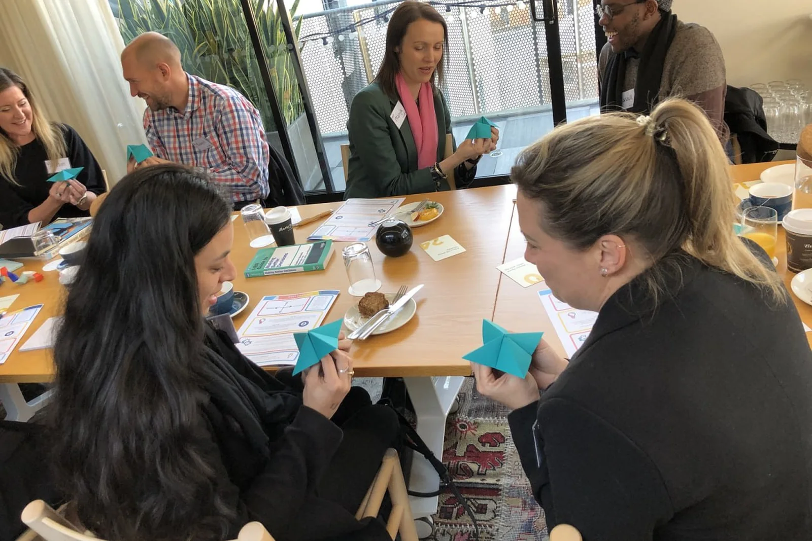 Essemy workshop in progress, a small group working through an activity together